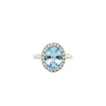 Blue Topaz and Diamond Halo Ring in White Gold