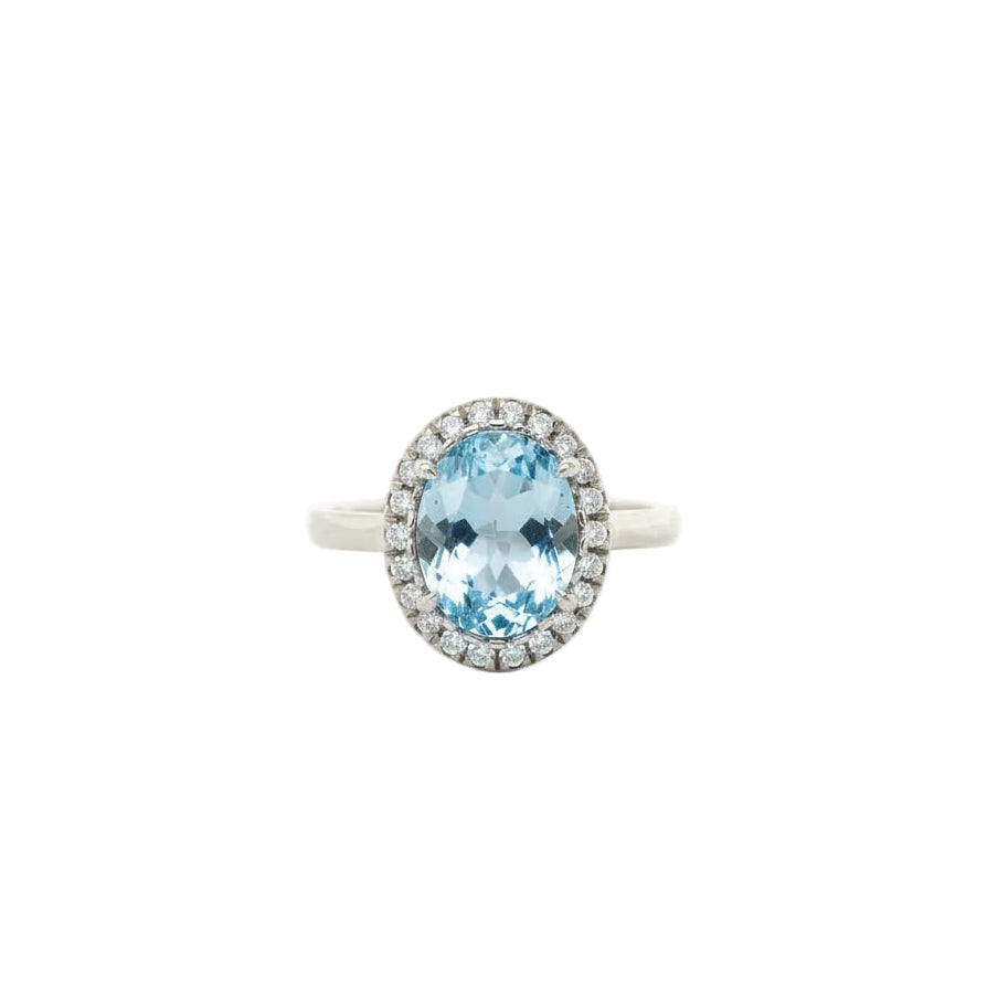 Blue Topaz and Diamond Halo Ring in White Gold