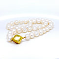 Pearl strand fitted with yellow gold clasp image 0